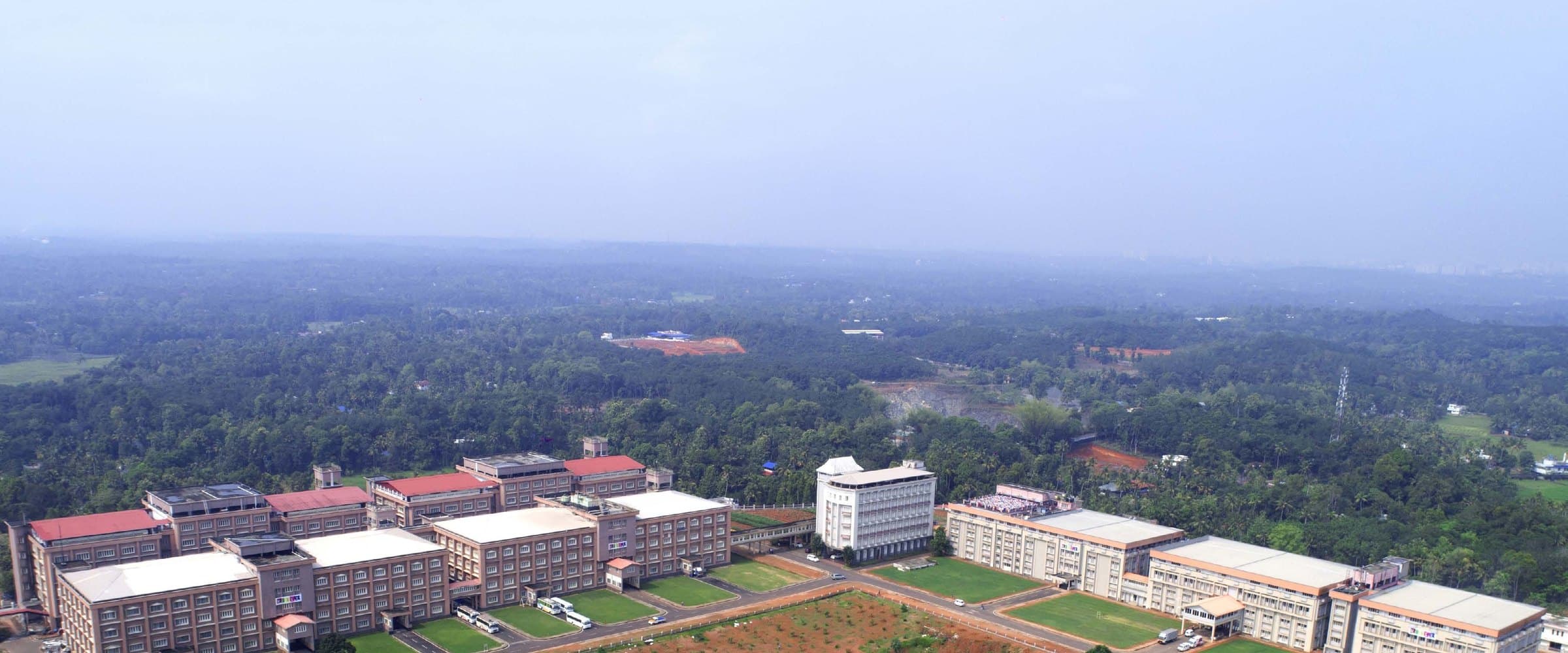 The Kizhakkambalam campus seen from the air, with the production halls set in surrounding farmland