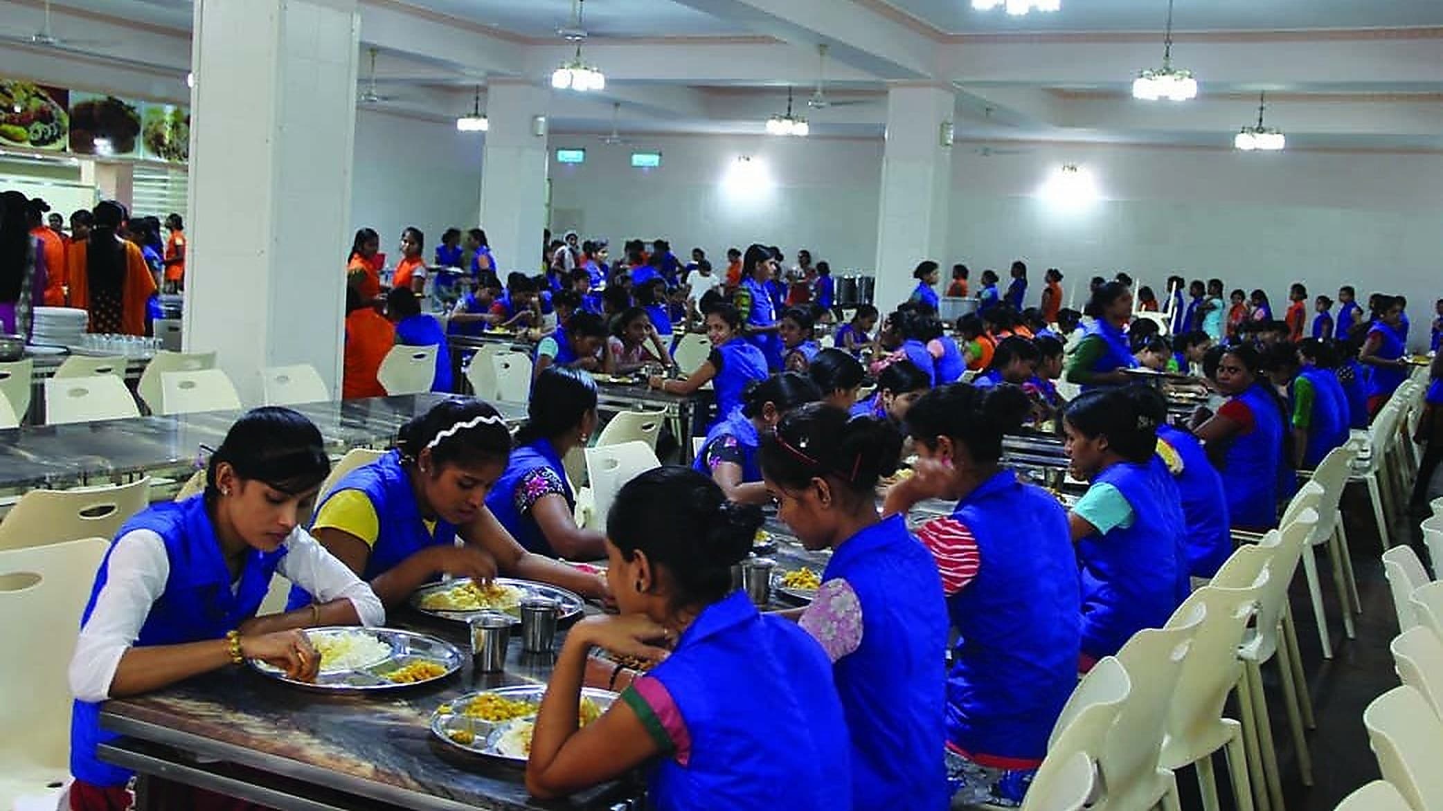 Employees at a meal in the dining hall