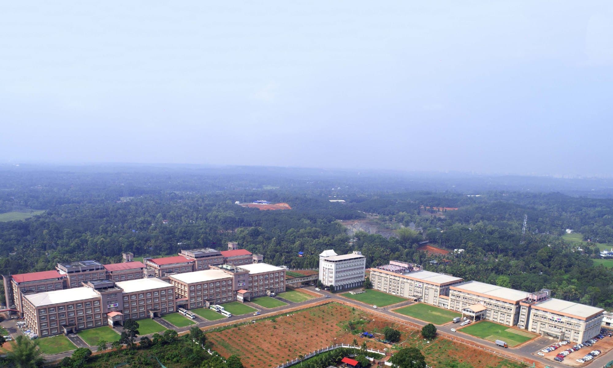 Aerial view of the Kizhakkambalam campus in the surrounding Kerala landscape